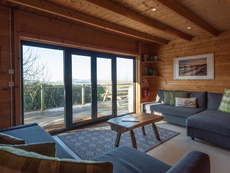 Toms Eco Lodge wood cabin lounge area crop