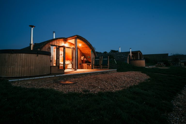 Toms Eco Lodge Tapnell Farm Modulog outside evening